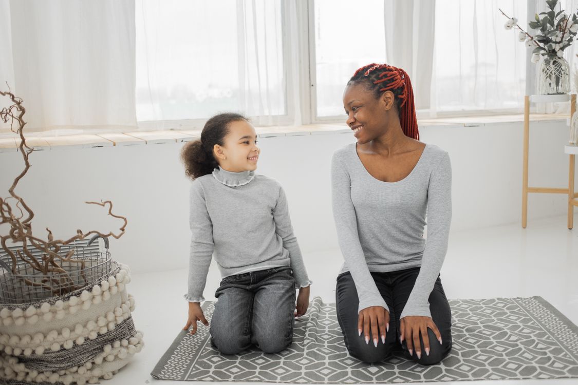 Stock photo of a mother and daughter smiling together